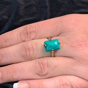 Turquoise look stone in silver setting